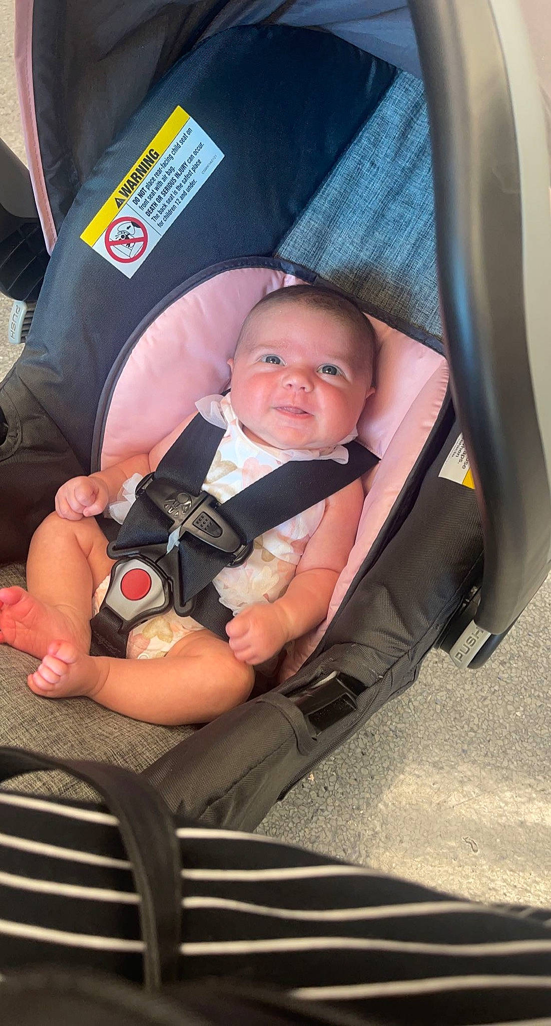 Cassidy is registered to the contest to win money with this photo: auto_part, automotive_design, baby, baby_carriage, baby_in_car_seat, baby_products, baby_safety, baby_toddler_clothing, car_seat, chair, child, comfort, fun, lap, mammal, person, sitting, thigh, thumb, toddler