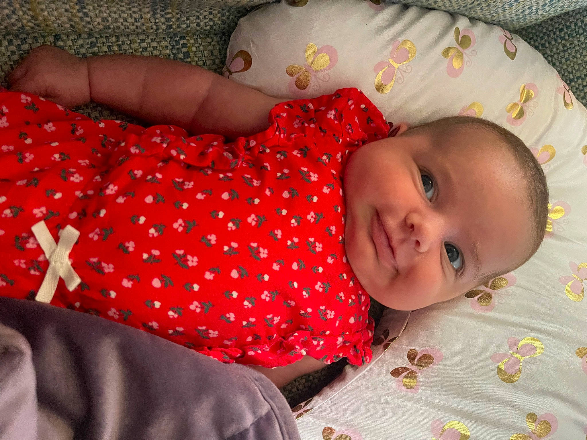 Cassidy joined the competition — help win amazing prizes! baby, baby_toddler_clothing, bed, bedding, bedtime, child, comfort, eye, face, human_body, linens, mammal, orange, pattern, person, red, skin, sleeve, textile, toddler