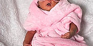 Janice is registered to the contest to win money with this photo: baby, pink, towel, sunglasses, blanket, infant, cute, face, headwear, foot, hand, relaxed, soft, wrapped, child, portrait, indoors, cozy, accessory, fashion