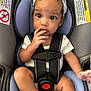 Nalani joined the competition — help win amazing prizes! baby, child, car_seat, headband, straps, safety, infant, curious, seated, clothing, white_shirt, sock, padded, seat, hands, fingers, cute, indoors, portrait, young