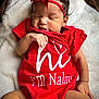 baby, infant, red_onesie, headband, sleeping, blanket, soft_texture, cute, newborn, peaceful, closeup, skin, hand, legs, indoors, portrait, child, person, comfort, resting