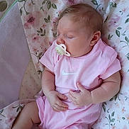 Lilyannah joined the competition — help win amazing prizes! baby, pacifier, sleeping, pink_clothing, blanket, floral, infant, cute, soft, peaceful, child, apparel, head, hand, footwear, indoors, resting, young, person, cozy