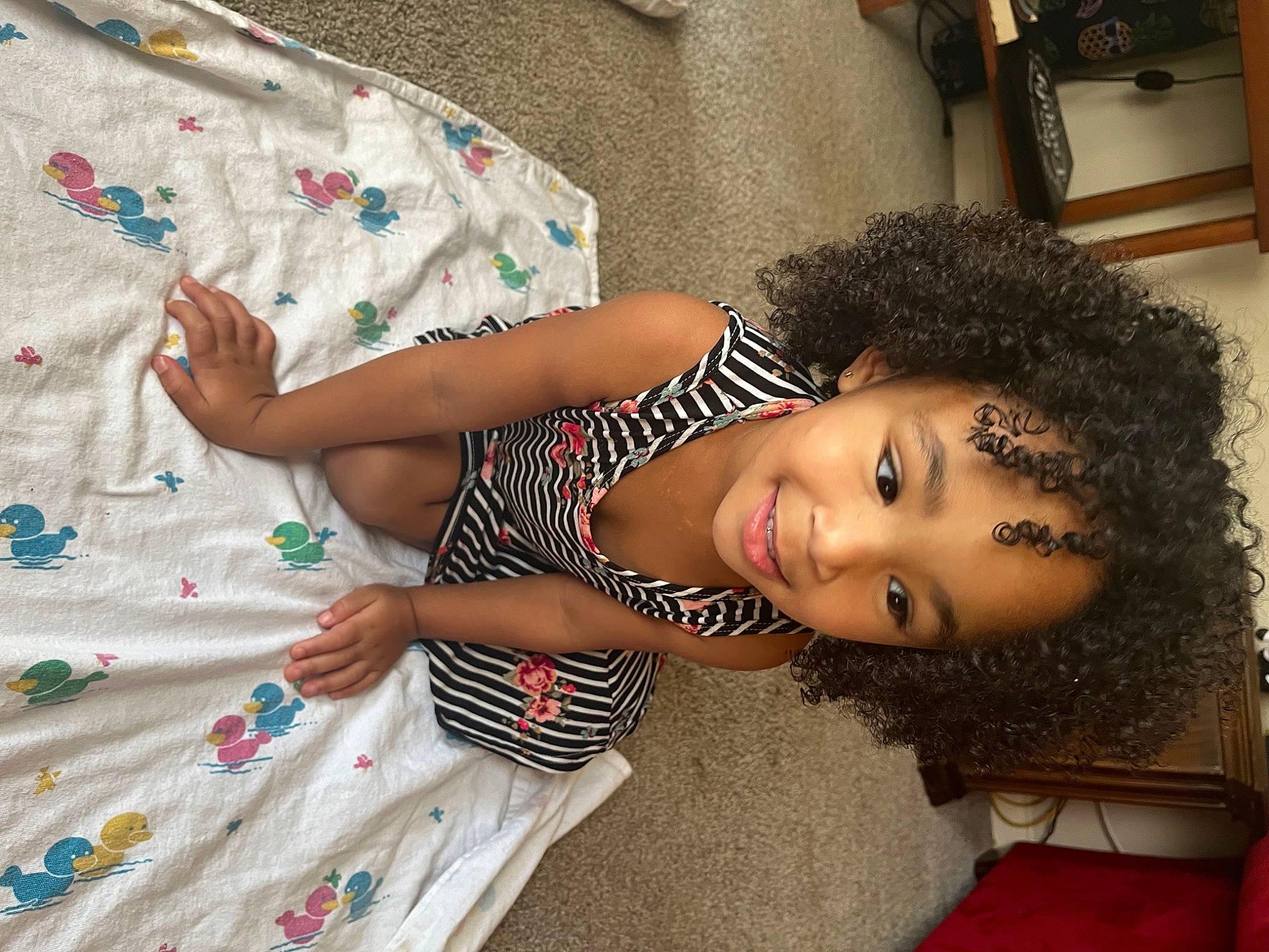 Brielle joined the competition — help win amazing prizes! adaptation, baby_toddler_clothing, black_hair, child, dress, fashion, flooring, fun, hairstyle, happy, joy, linens, pattern, people, person, skin, sleeve, smile, t_shirt, textile