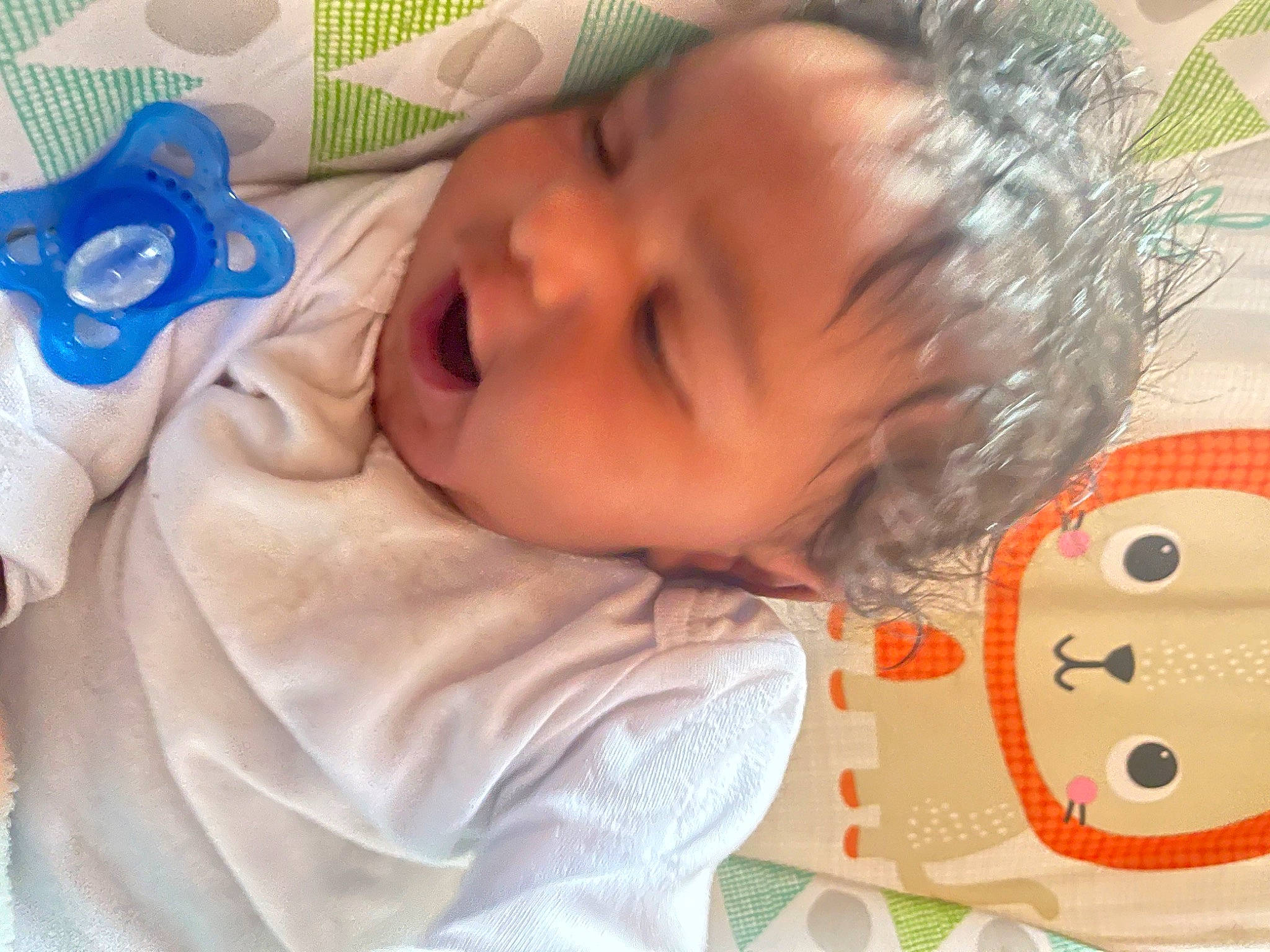 Leonidas is registered to the contest to win money with this photo: baby, baby_products, baby_sleeping, baby_toddler_clothing, bedtime, cheek, child, chin, comfort, eyelash, face, happy, head, linens, mouth, nose, person, product, skin, smile