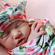 Christlynn joined the competition — help win amazing prizes! newborn, baby, sleeping, floral, blanket, headband, peaceful, infant, cute, soft, portrait, wrapped, closeup, skin, hand, resting, indoors, cozy, pink, adorable