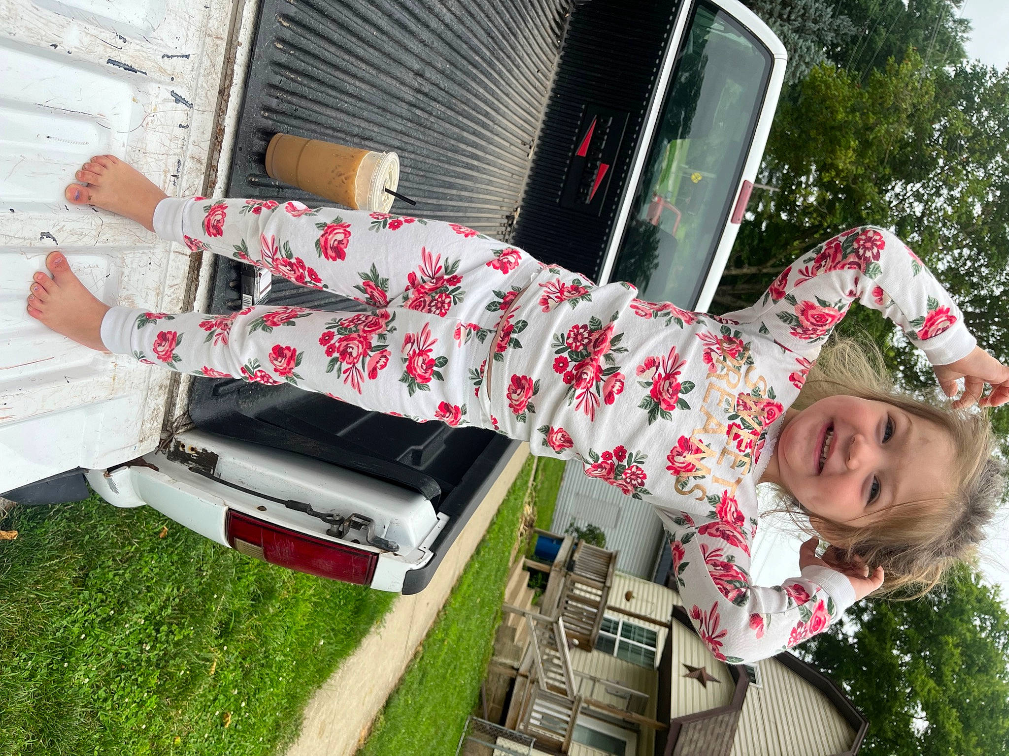 Emmalyn is registered to the contest to win money with this photo: auto_part, automotive_exterior, bumper, chair, couch, event, fun, grass, happy, holiday, joy, leisure, motor_vehicle, outdoor_furniture, pattern, person, plant, smile, toddler, tree