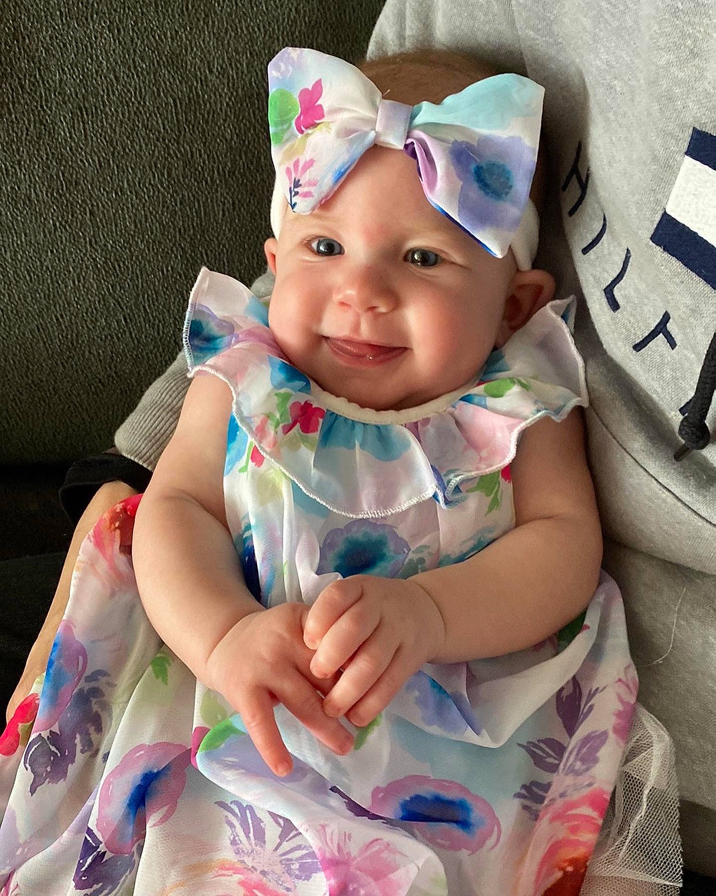 Charlotte is registered to the contest to win money with this photo: baby, baby_products, baby_toddler_clothing, cap, cheek, costume_hat, dress, eye, face, fun, happy, head, headgear, headpiece, headwear, person, pink, purple, skin, sleeve