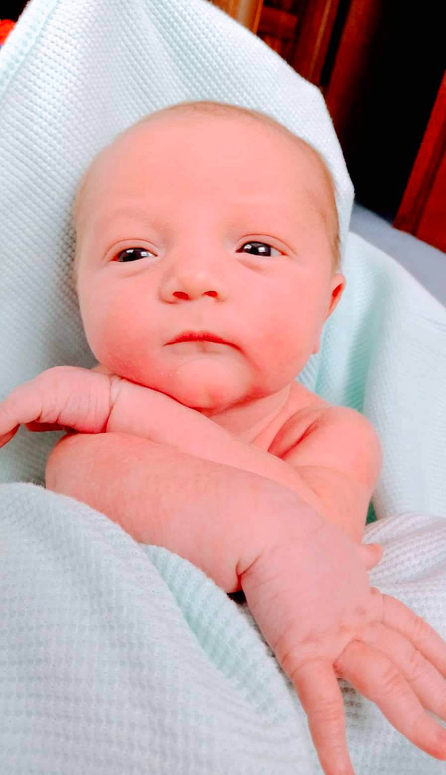 Jesiah joined the competition — help win amazing prizes! baby, baby_toddler_clothing, cheek, child, comfort, eyelash, finger, hand, iris, linens, magenta, nail, nose, peach, person, pink, portrait_photography, skin, sleeve, thumb