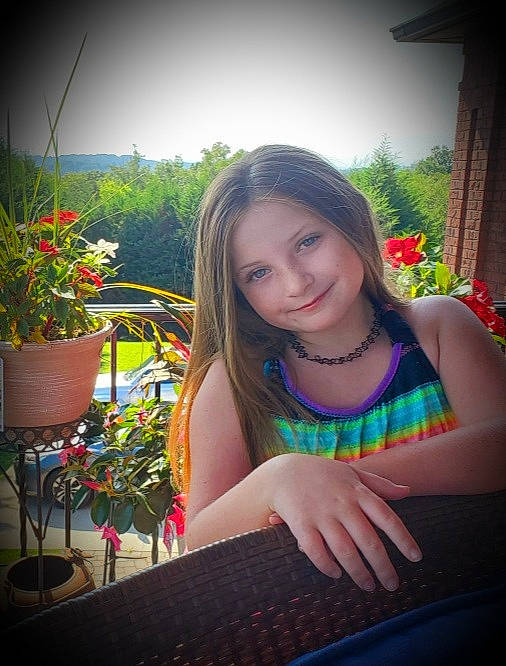 Cherish is registered to the contest to win money with this photo: eye, facial_expression, flash_photography, flower, flowerpot, grass, happy, houseplant, iris, joy, leisure, light, lip, morning, nature, people_in_nature, person, photograph, plant, skin