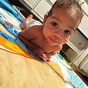 Cash joined the competition — help win amazing prizes! baby, infant, play_mat, floor, face, eyes, smile, hand, home, furniture, cabinet, colorful, curly_hair, skin, child, indoor, person, toddler, expression, cute