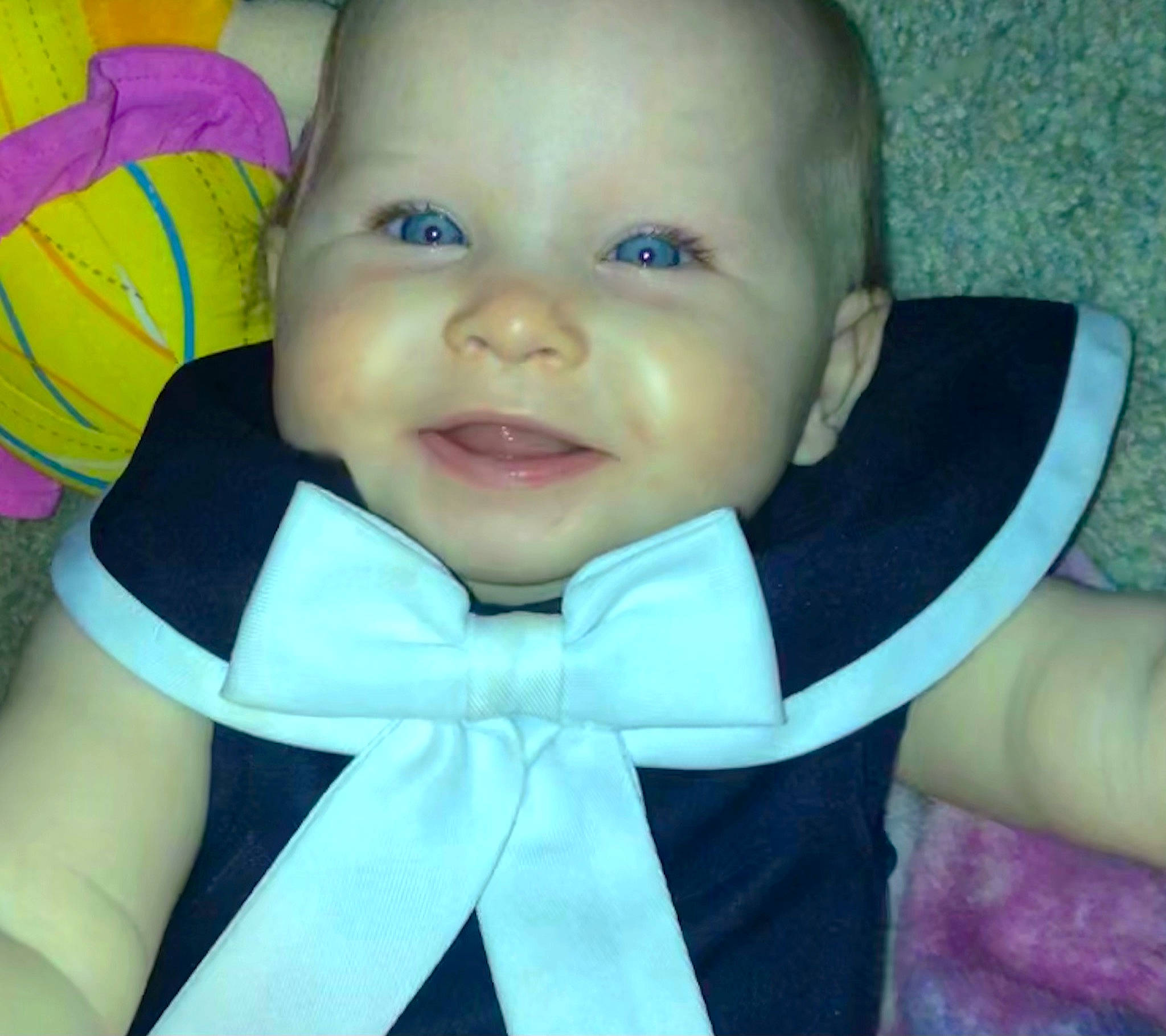 Caroline joined the competition — help win amazing prizes! azure, baby, baby_toddler_clothing, cheek, eye, eyebrow, face, happy, headgear, human_body, iris, neck, nose, outerwear, person, product, purple, skin, sleeve, smile