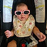 baby, infant, sunglasses, bib, car_seat, child, cute, fashion, accessory, seatbelt, portrait, indoor, happy, small_hands, child_seat, safety, baby_clothes, headwear, relaxing, adorable