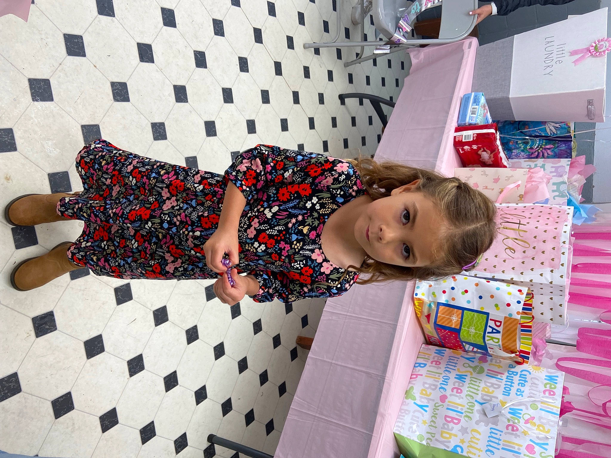Emberlynn is registered to the contest to win money with this photo: carmine, child, elbow, flooring, fun, happy, human_leg, leisure, pattern, person, play, product, room, sandal, smile, thigh, toddler