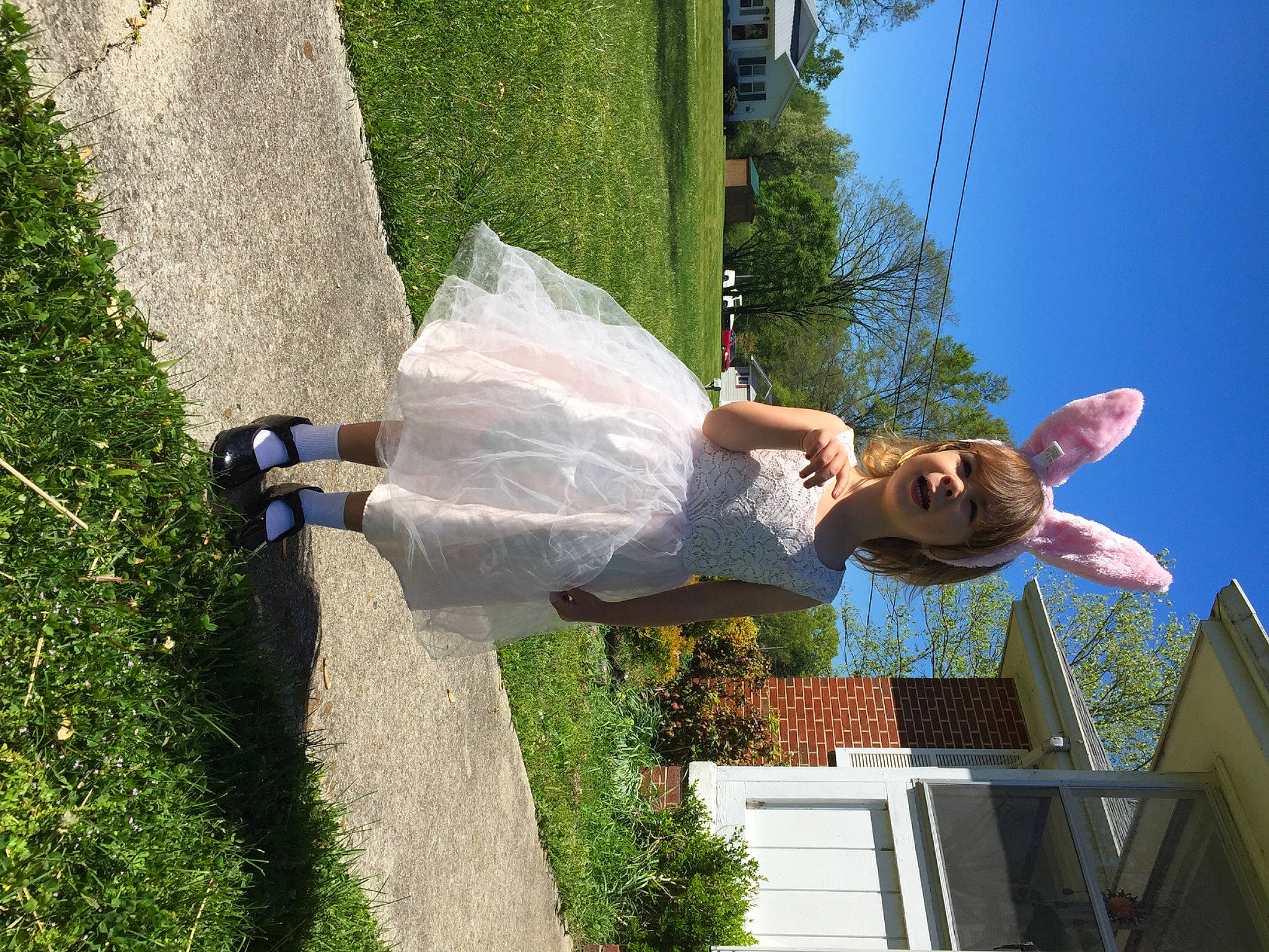 Emberlynn is registered to the contest to win money with this photo: daytime, eyewear, fun, grass, green, happy, house, landscape, leisure, people_in_nature, person, plant, recreation, shrub, sky, smile, summer, sunglasses, tree, vacation