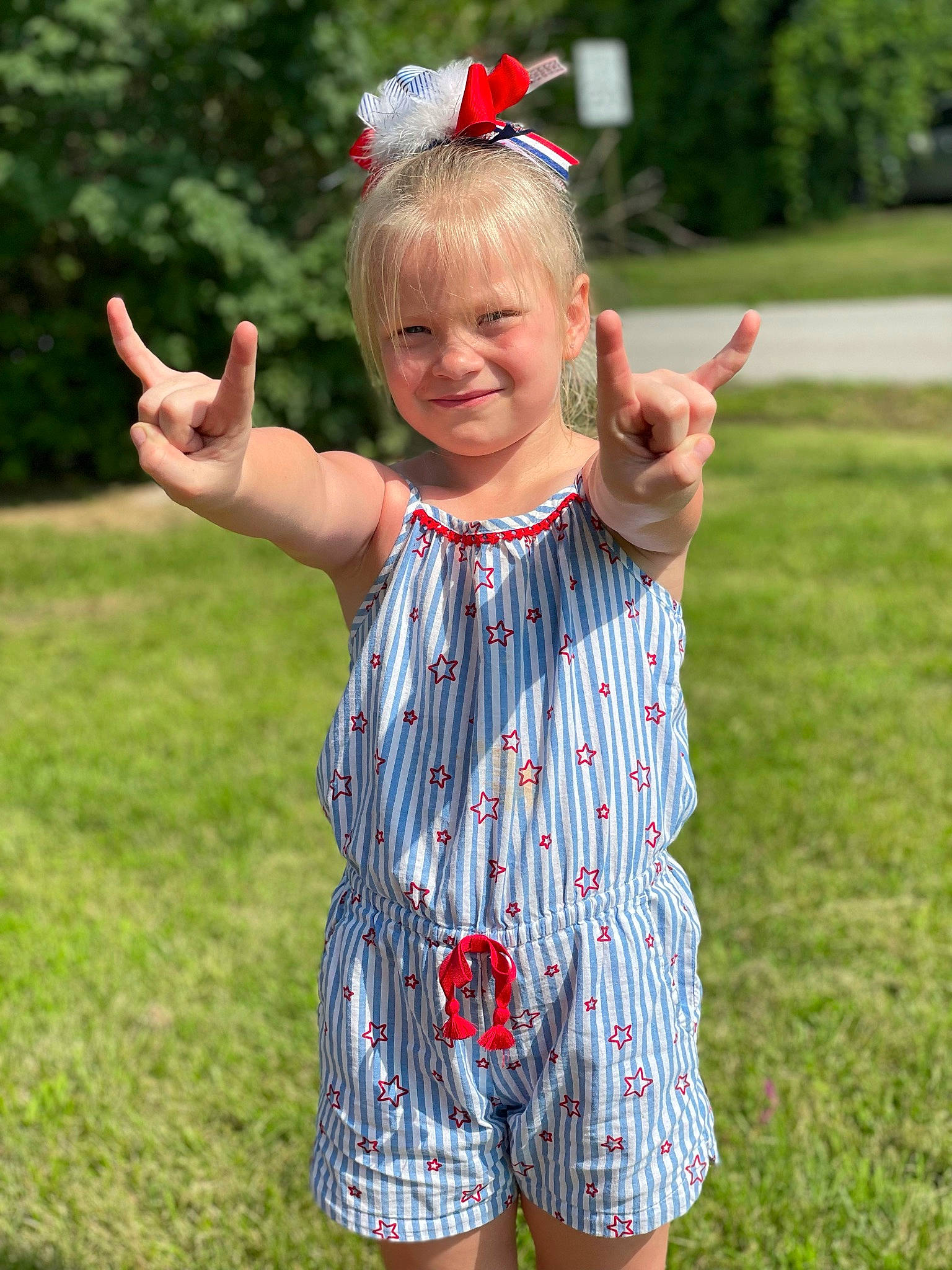 Maisey is registered to the contest to win money with this photo: day_dress, finger, fun, gesture, grass, green, hair, hand, happy, head, joy, meadow, people, people_in_nature, person, photograph, plant, sleeve, smile, summer
