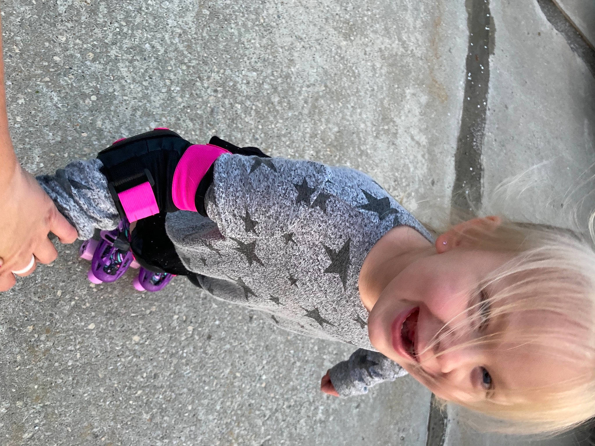 Maisey is registered to the contest to win money with this photo: asphalt, baby, calf, child, concrete, eyewear, fashion_accessory, fun, grass, human_leg, leisure, magenta, person, recreation, road_surface, sand, shadow, sidewalk, smile, toddler