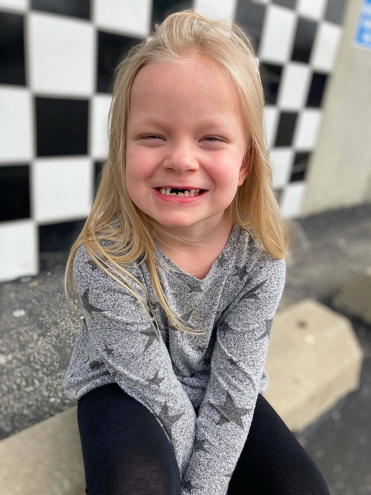 Maisey is registered to the contest to win money with this photo: black, blond, child, eyebrow, fun, grey, hair, happy, head, human_body, iris, joy, lip, pattern, person, skin, sleeve, smile, standing, t_shirt