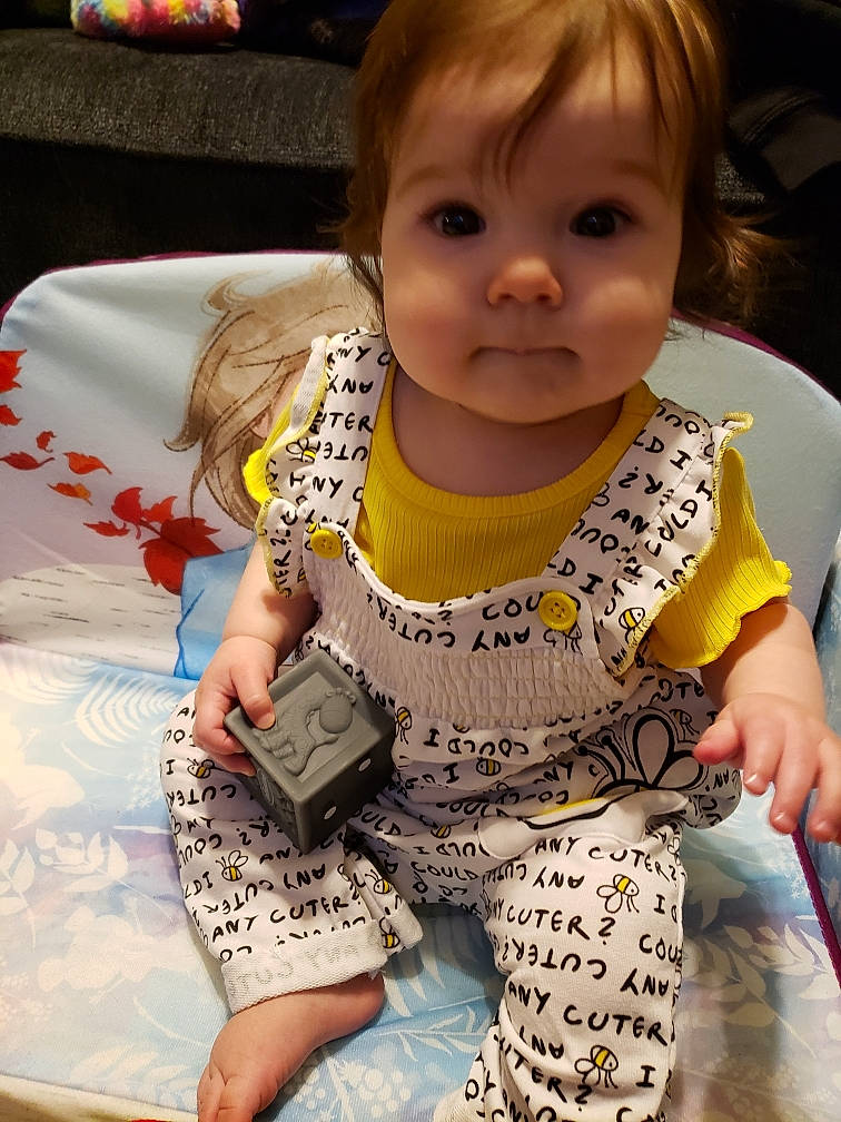 Amaryah joined the competition — help win amazing prizes! baby, baby_toddler_clothing, cheek, child, outerwear, person, play, sitting, skin, sleeve, textile, toddler, yellow