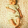 Bellefyre joined the competition — help win amazing prizes! baby, infant, sleepy, floral_outfit, blanket, pattern, lying_down, skin, foot, hand, portrait, cute, child, soft_light, indoors, newborn, young, peaceful, resting, face
