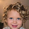 baby, blond_hair, blue_eyes, cheerful, child, closeup, curly_hair, cute, expression, face, happy, headshot, indoors, innocent, person, portrait, skin, smile, toddler, young_child