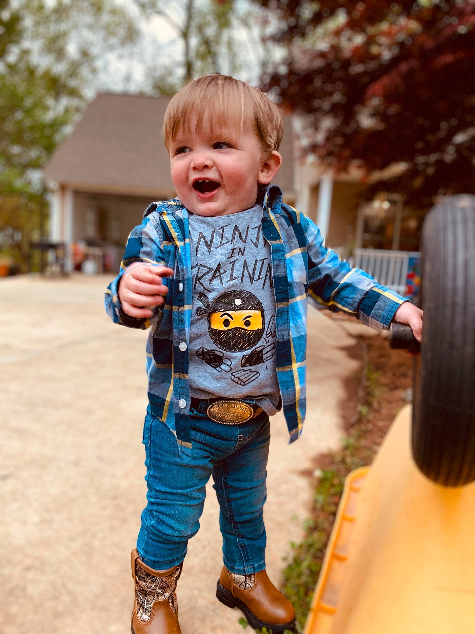 Bryce joined the competition — help win amazing prizes! baby_toddler_clothing, cool, eye, fun, grass, happy, human_body, leg, leisure, orange, people_in_nature, person, plant, sleeve, smile, standing, street_fashion, t_shirt, tire, toddler