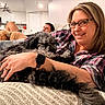 Bear joined the competition — help win amazing prizes! black_dog, blanket, brown_dog, carpet, couch, cozy, cuddle, dog, glasses, home, indoors, living_room, man, pet, plaid_shirt, relaxed, smartwatch, smile, video_controller, woman