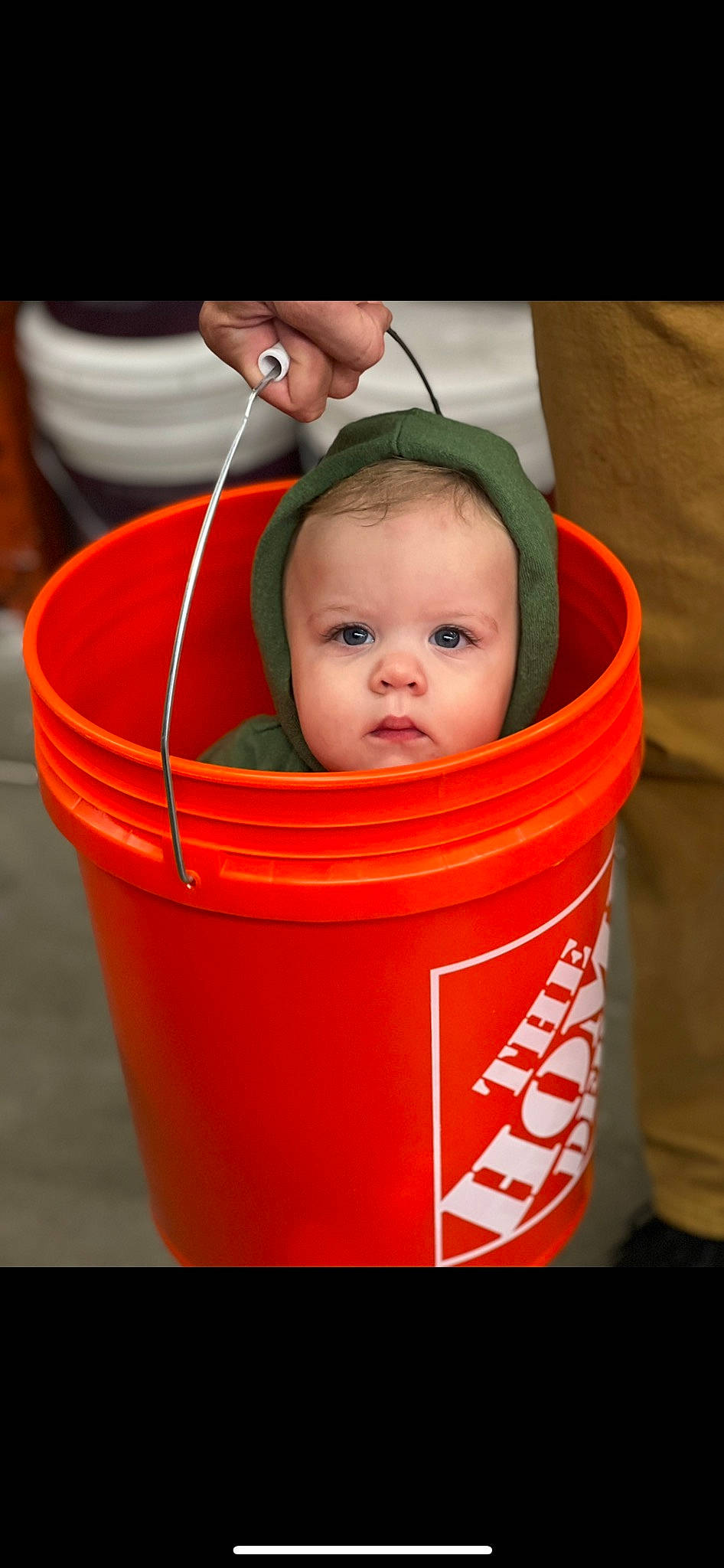 Jericho is registered to the contest to win money with this photo: audio_equipment, baby, baby_products, bucket, child, drinkware, flooring, fun, gas, orange, person, plastic, play, toddler, wood