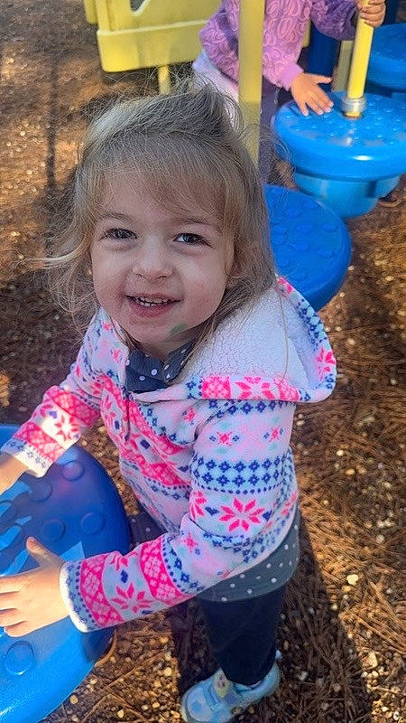 Lisa joined the competition — help win amazing prizes! baby_toddler_clothing, blue, child, city, fun, grass, happy, head, iris, joy, leisure, magenta, outdoor_play_equipment, pattern, people_in_nature, person, recreation, sitting, smile, soil