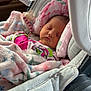 Kimber is registered to the contest to win money with this photo: baby, sleeping, blanket, car_seat, infant, child, pink, soft, cushion, pacifier, headrest, resting, cute, indoors, clothing, relaxation, peaceful, newborn, portrait, toddler