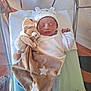 Aylan a rejoint le concours — aidez-le/la à gagner de superbes lots ! newborn, baby, sleeping, hospital_crib, plush_toy, blanket, hat, white_clothing, soft_toy, stars, infant, peaceful, cute, baby_clothes, indoor, resting, small_baby, child, hospital, toddler