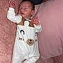 baby, sleeping, onesie, bear_face, pillow, blanket, soft_texture, pink, white, cozy, infant, cute, peaceful, resting, child, indoor, portrait, comfort, clothing, face