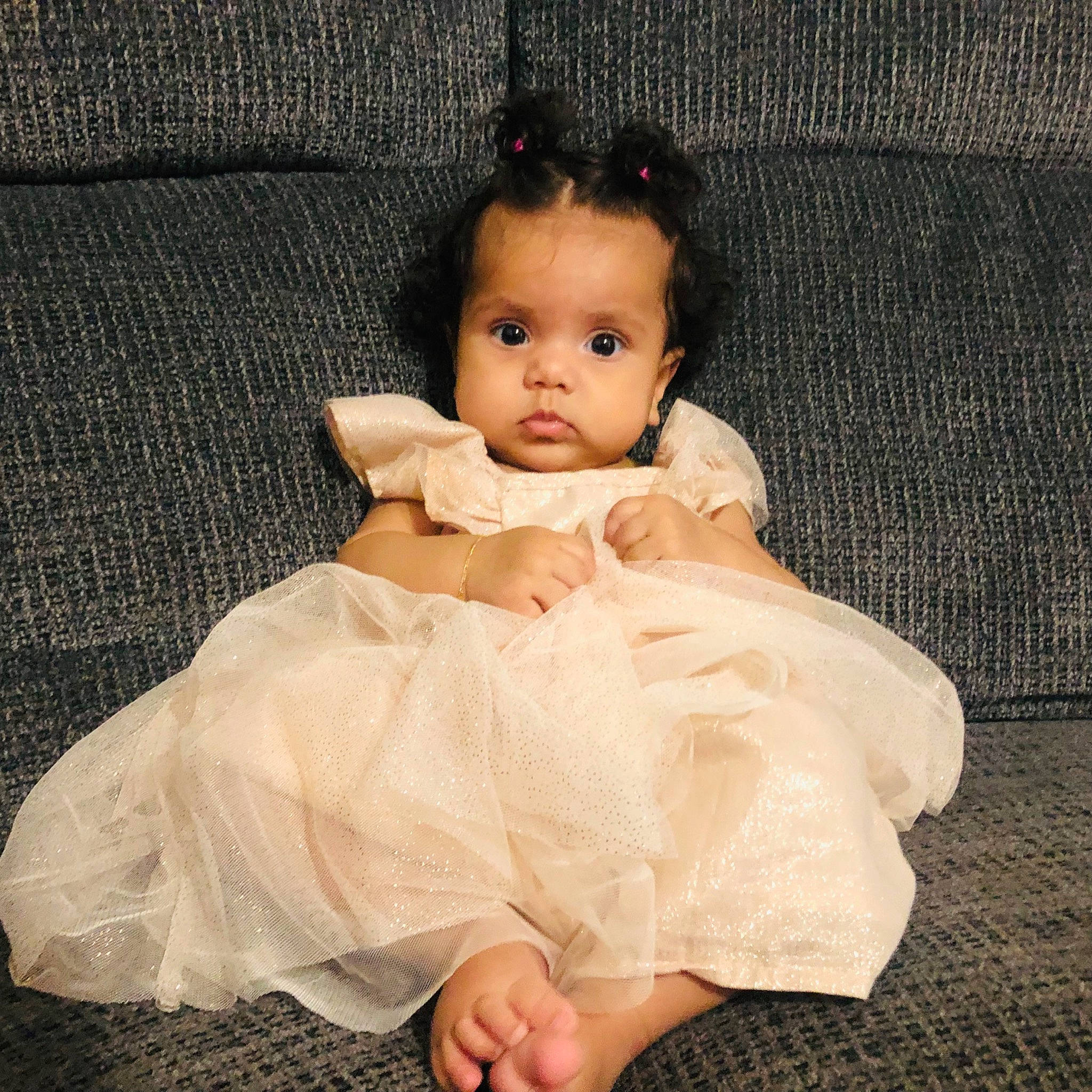 Amiyah joined the competition — help win amazing prizes! baby, baby_toddler_clothing, bridal_accessory, day_dress, dress, embellishment, eyelash, face, flash_photography, head, headpiece, human_body, iris, lip, neck, person, shoulder, skin, sleeve, textile