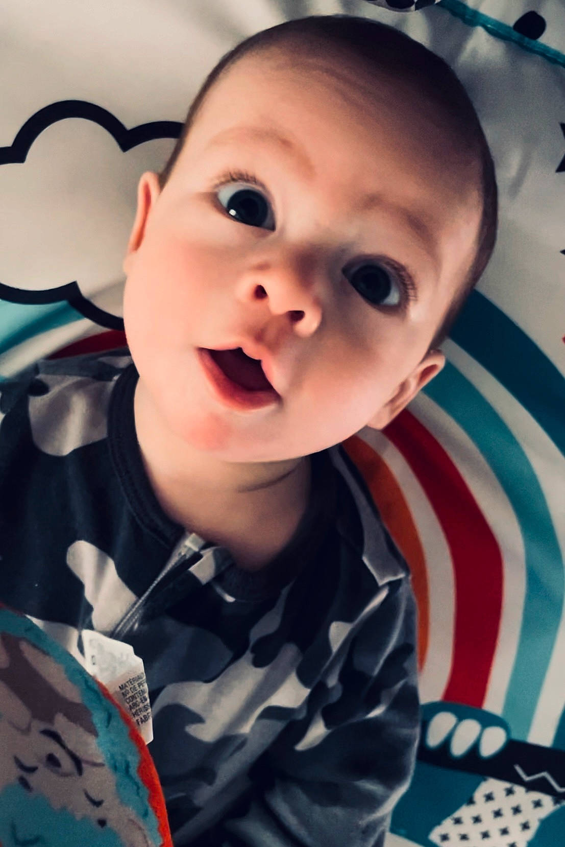 Leighlin is registered to the contest to win money with this photo: baby, baby_toddler_clothing, cheek, chin, cool, eye, eyebrow, eyelash, face, flash_photography, gesture, happy, iris, lip, mouth, nose, person, skin, sleeve, smile