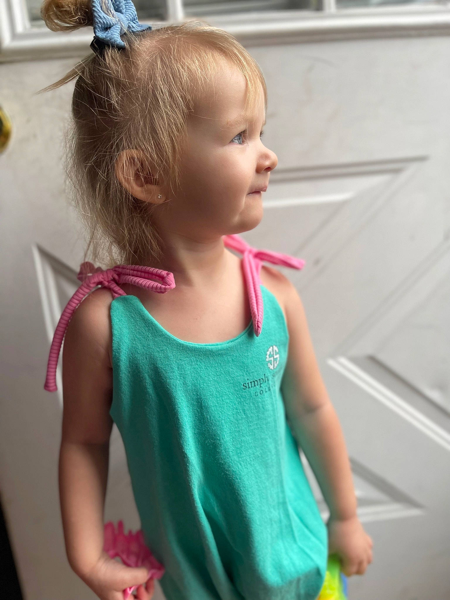 Oakley is registered to the contest to win money with this photo: active_tank, baby_toddler_clothing, blond, child, electric_blue, fun, gesture, hair, hairstyle, happy, joint, neck, person, pink, shoulder, sleeve, sleeveless_shirt, standing, t_shirt, toddler
