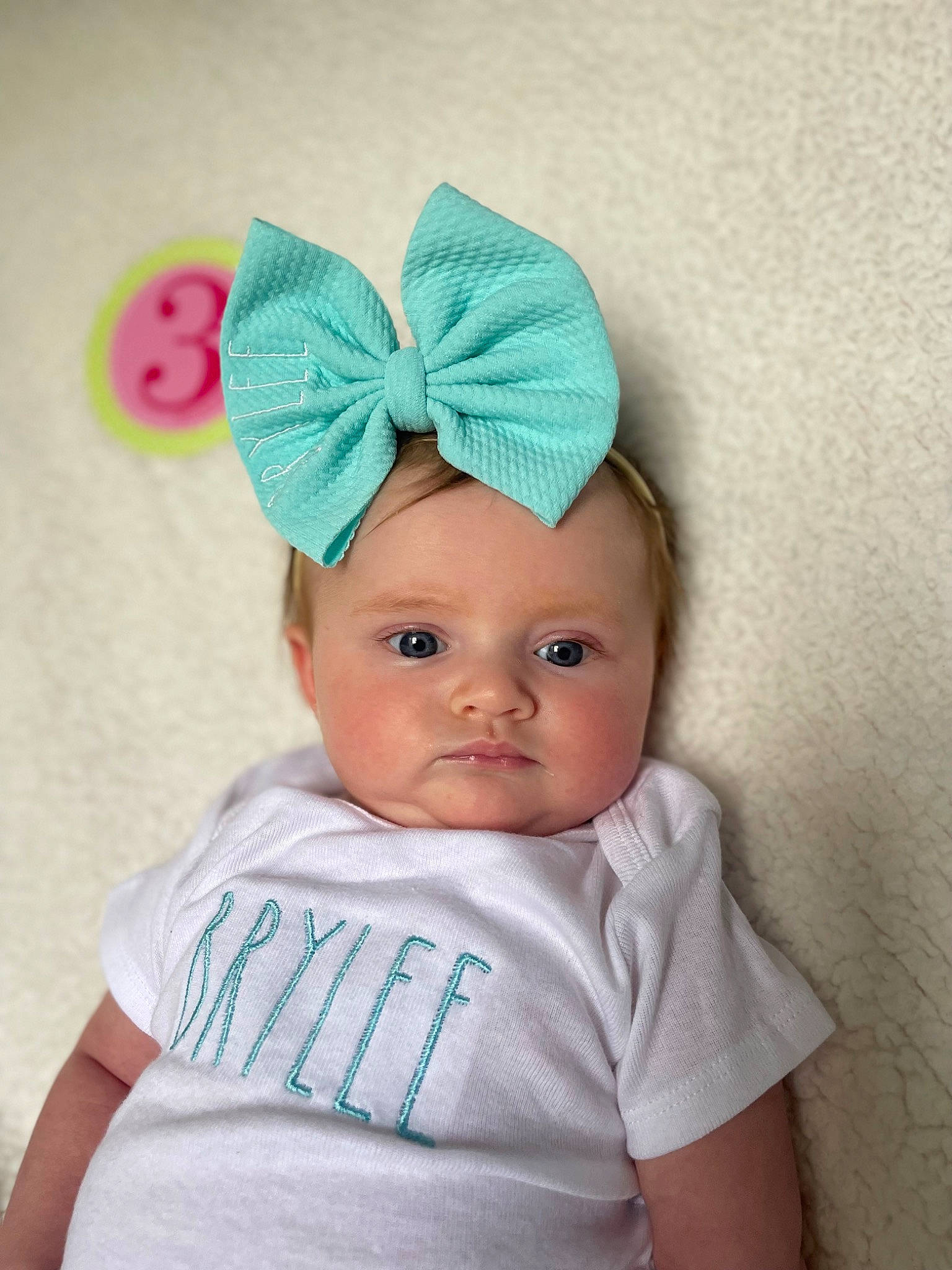 Brylee is registered to the contest to win money with this photo: baby, baby_toddler_clothing, beanie, cap, child, clothing, costume_hat, electric_blue, eye, fashion_accessory, hair_accessory, hat, headband, headpiece, headwear, magenta, neck, person, pink, sleeve
