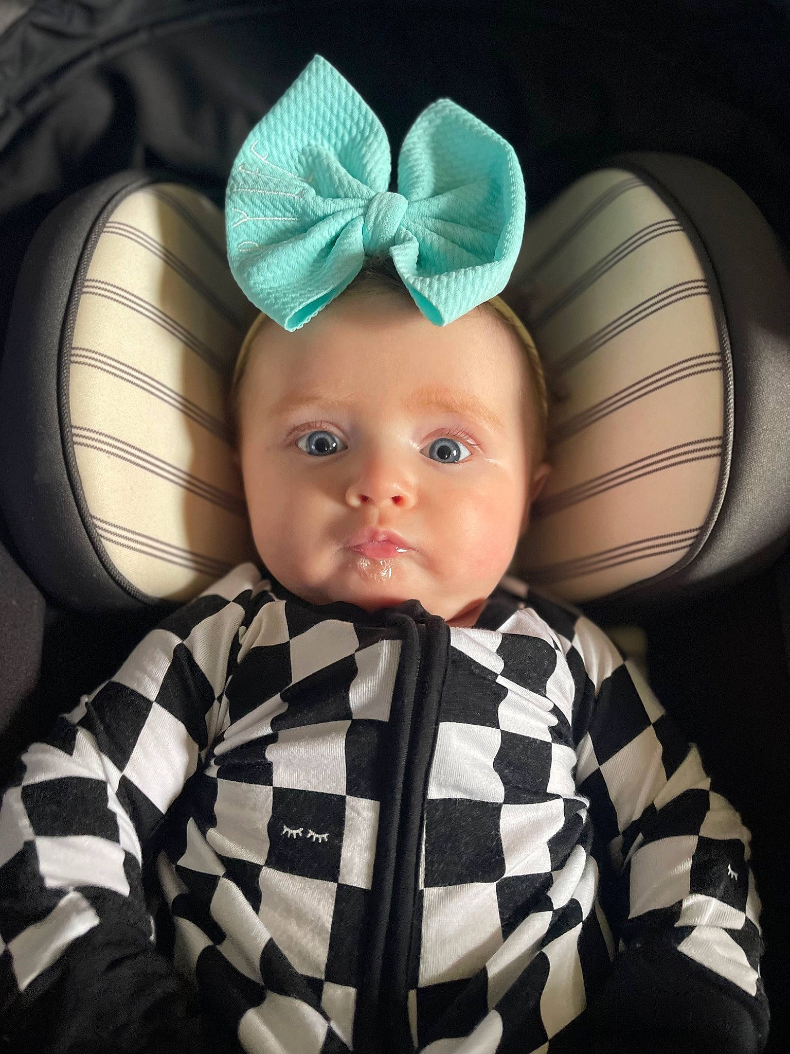 Brylee is registered to the contest to win money with this photo: baby, baby_products, baby_toddler_clothing, cap, car_seat, cheek, child, comfort, costume_hat, eye, eyebrow, face, fashion_accessory, flash_photography, hair_accessory, head, outerwear, pattern, person, sleeve