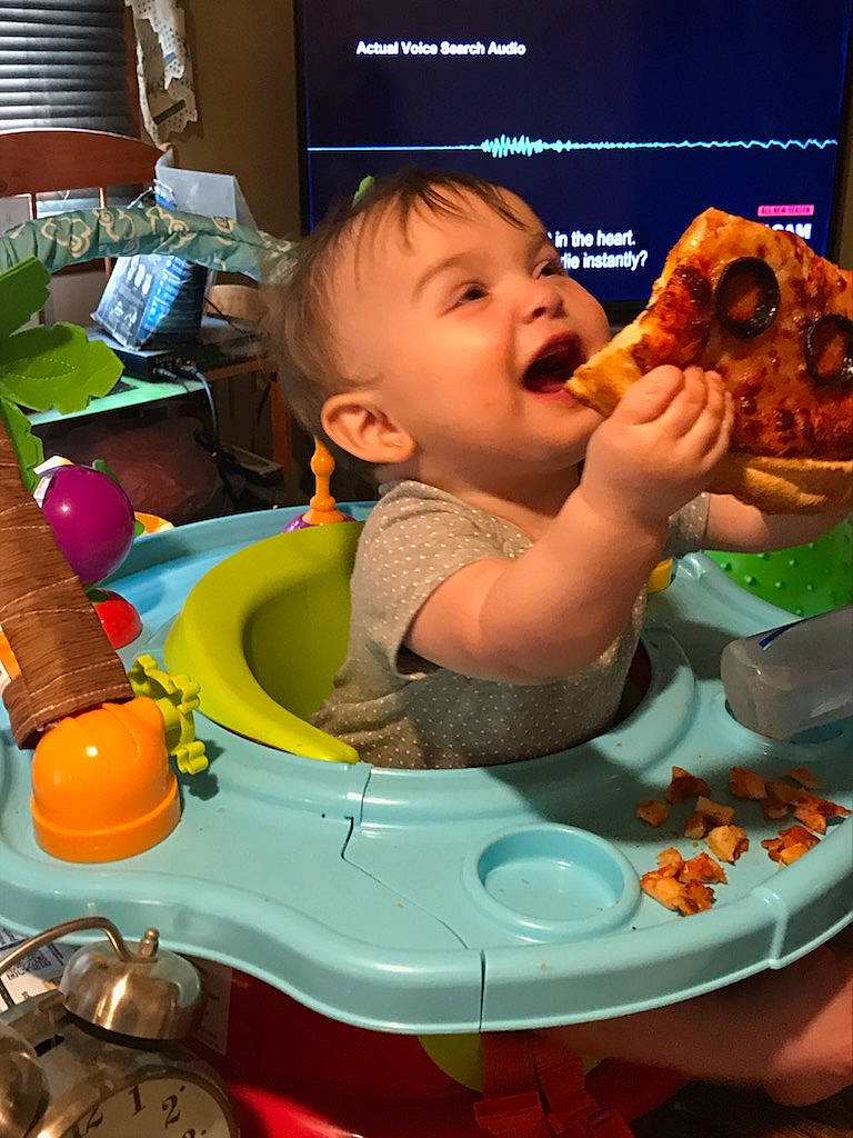 Elliana is registered to the contest to win money with this photo: baby, chair, child, comfort_food, cuisine, eating, finger_food, food_craving, fun, junk_food, meal, orange, person, plastic, play, sharing, sitting, sweetness, tableware, toddler