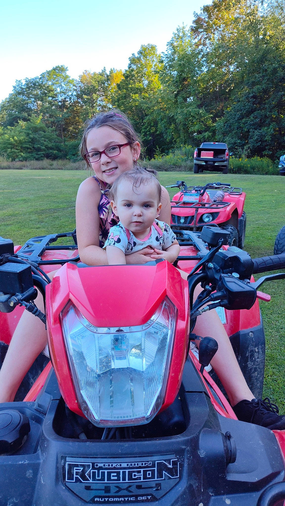 Olivia joined the competition — help win amazing prizes! automotive_design, automotive_exterior, automotive_tire, automotive_wheel_system, baby_carriage, bumper, fun, glasses, grass, joy, lap, leisure, motor_vehicle, person, plant, sky, summer, tire, toddler, tree