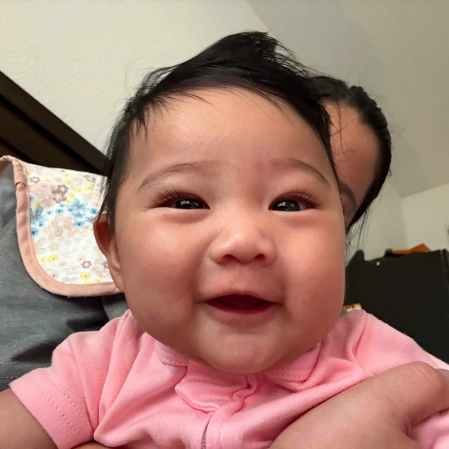 Paula is registered to the contest to win money with this photo: architecture, baby, babylaughing, bodypart, building, couch, cushion, face, furniture, happy, head, homedecor, indoors, laughing, mouth, person, photography, portrait, shoulder, smile