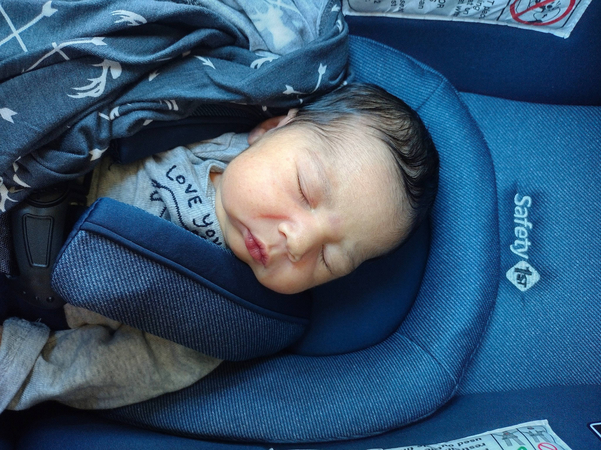 Maxwell is registered to the contest to win money with this photo: auto_part, baby, baby_carriage, baby_in_car_seat, baby_products, baby_sleeping, baby_toddler_clothing, car_seat, child, comfort, electric_blue, grass, linens, nap, person, sitting, sleep, toddler