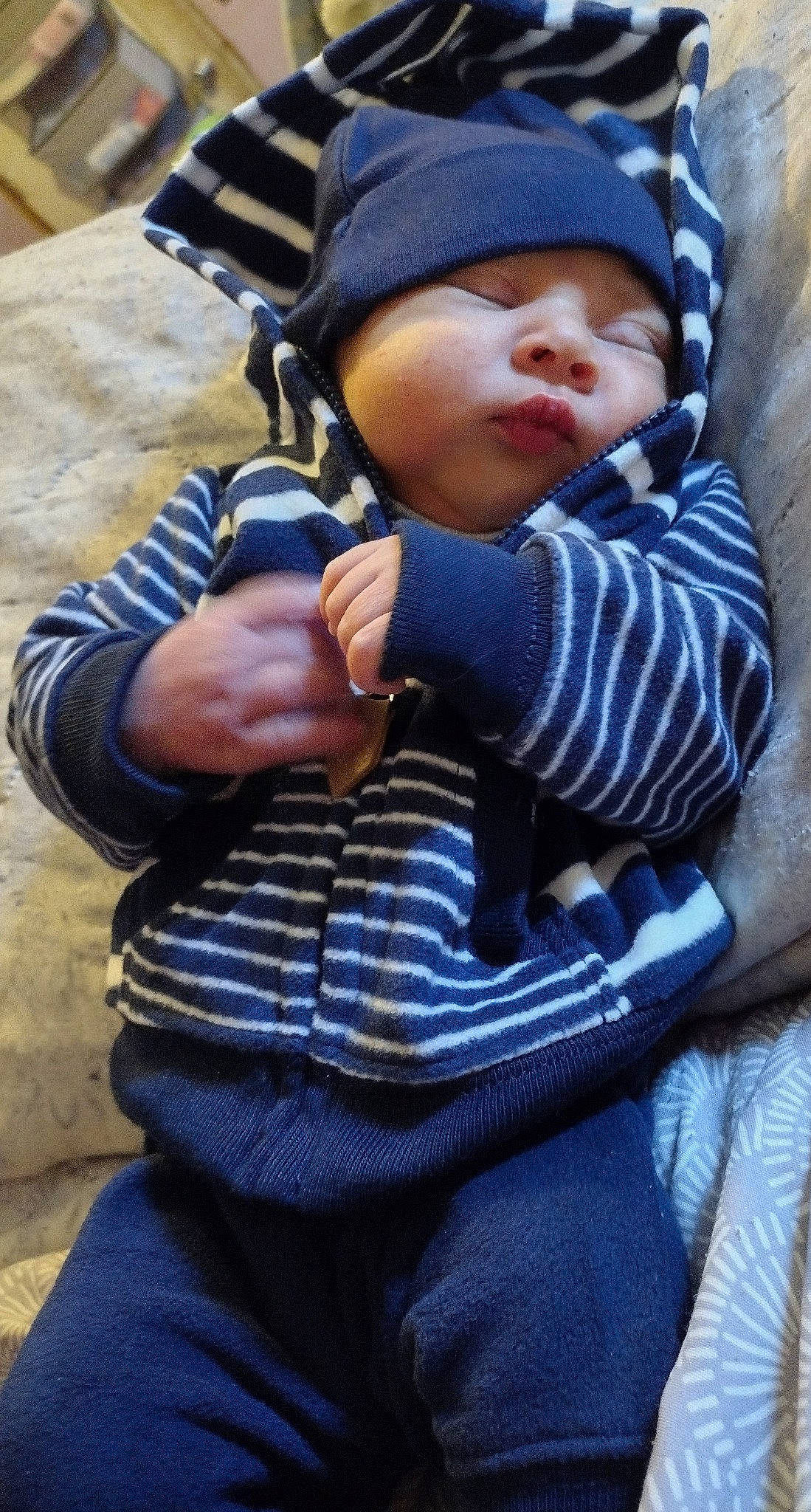 Maxwell joined the competition — help win amazing prizes! baby, baby_carriage, baby_products, baby_toddler_clothing, beanie, cap, child, comfort, electric_blue, face, gesture, grass, hat, headwear, person, plant, sitting, sleeve, thumb, toddler