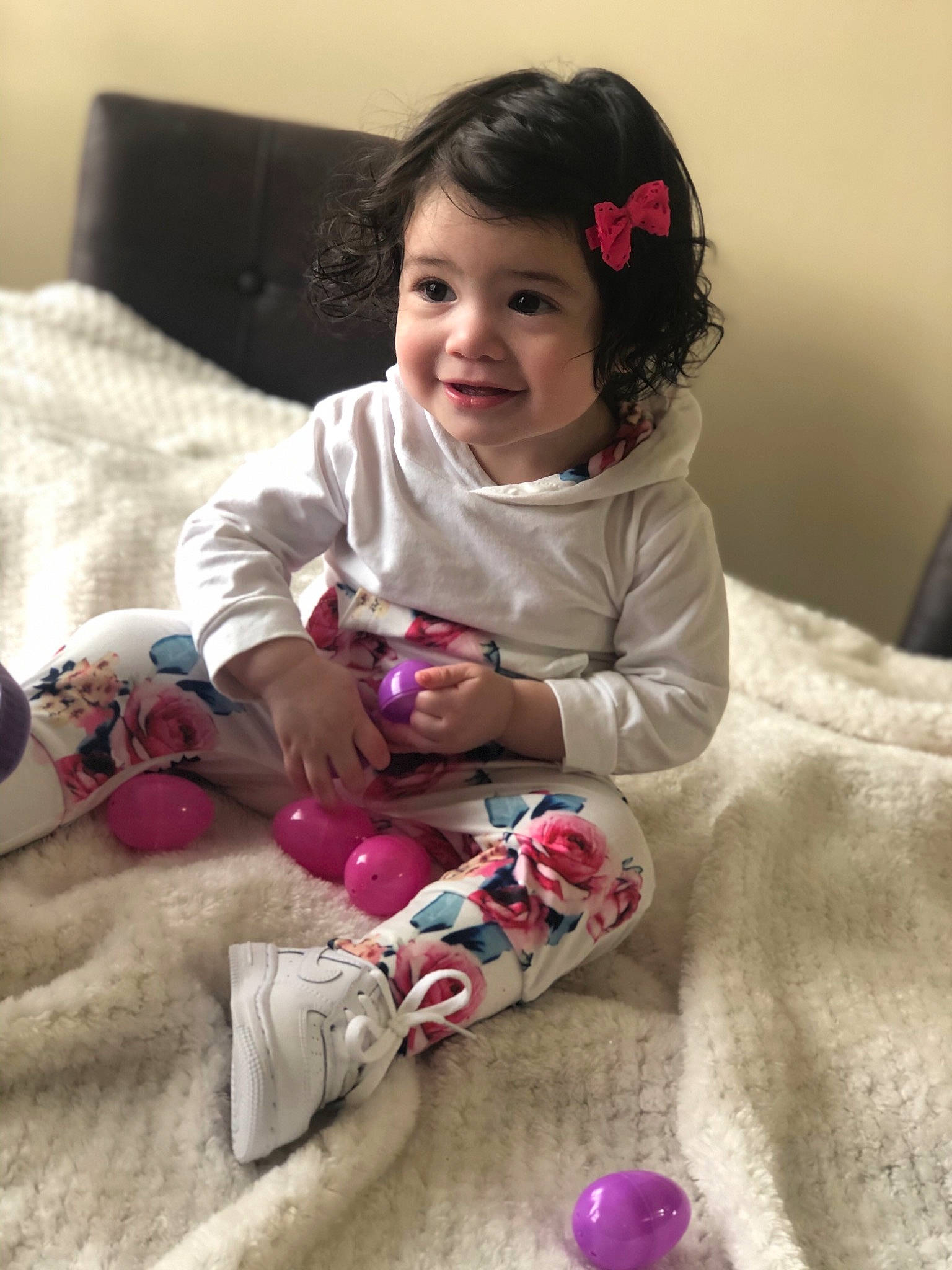 Violet is registered to the contest to win money with this photo: baby, beauty, cheek, child, happy, joy, outerwear, person, pink, play, sitting, skin, sleeve, smile, toddler
