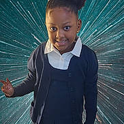 Kaidence is registered to the contest to win money with this photo: child, girl, smile, peace_sign, hair_bow, school_uniform, cardigan, pleated_skirt, white_shirt, portrait, standing, happy, dark_skin, earrings, background, starburst, space_effect, casual_pose, front_view, young