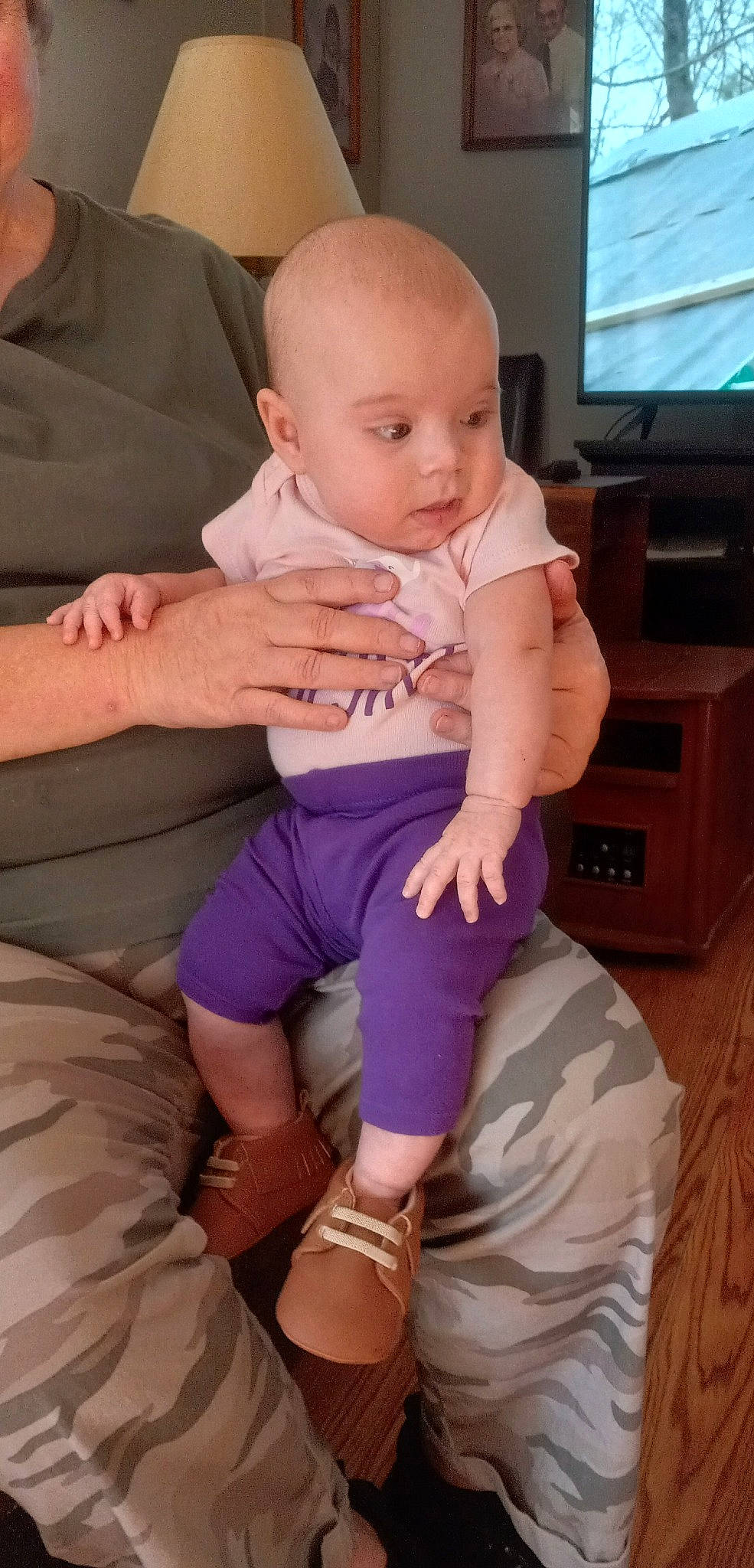 Baleigh is registered to the contest to win money with this photo: baby, baby_toddler_clothing, cheek, child, comfort, finger, gesture, joint, knee, lap, leg, person, pink, purple, shoulder, standing, television, thigh, thumb, toddler