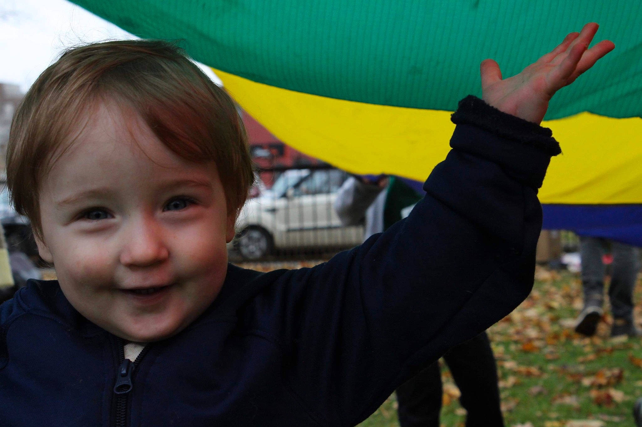 Jeriah joined the competition — help win amazing prizes! balloon, car, daytime, facial_expression, fun, gesture, grass, happy, joy, leisure, morning, party_supply, person, recreation, smile, snapshot, t_shirt, tire, toddler, tree