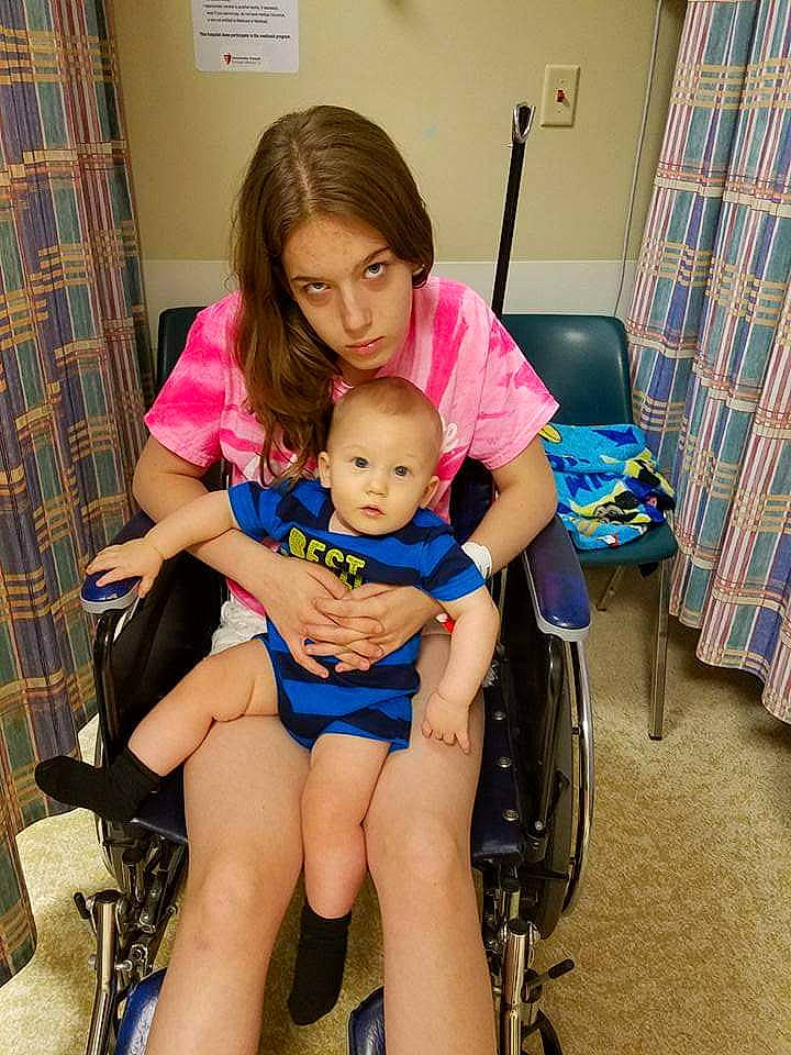 Joey is registered to the contest to win money with this photo: baby_toddler_clothing, chair, comfort, curtain, happy, human_leg, joint, knee, lap, leg, leisure, person, room, service, shorts, shoulder, sitting, skin, thigh, toddler