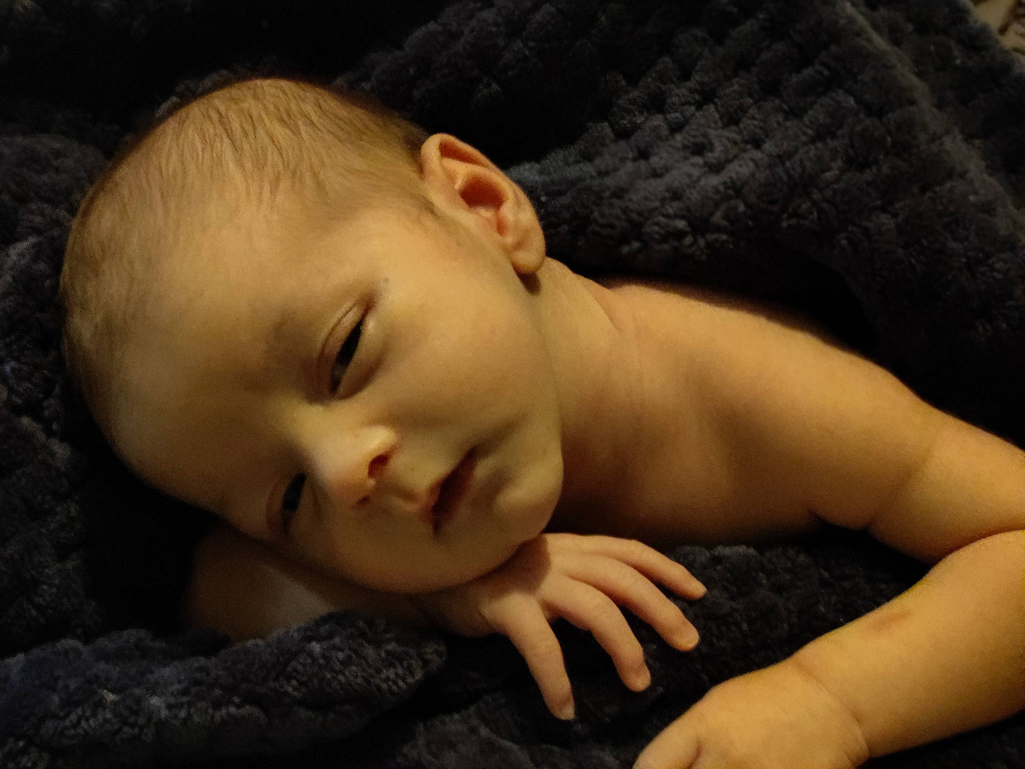 Jonah is registered to the contest to win money with this photo: baby, cheek, chin, comfort, ear, eye, eyebrow, eyelash, face, finger, flash_photography, hand, human_body, iris, lip, mouth, neck, nose, person, skin