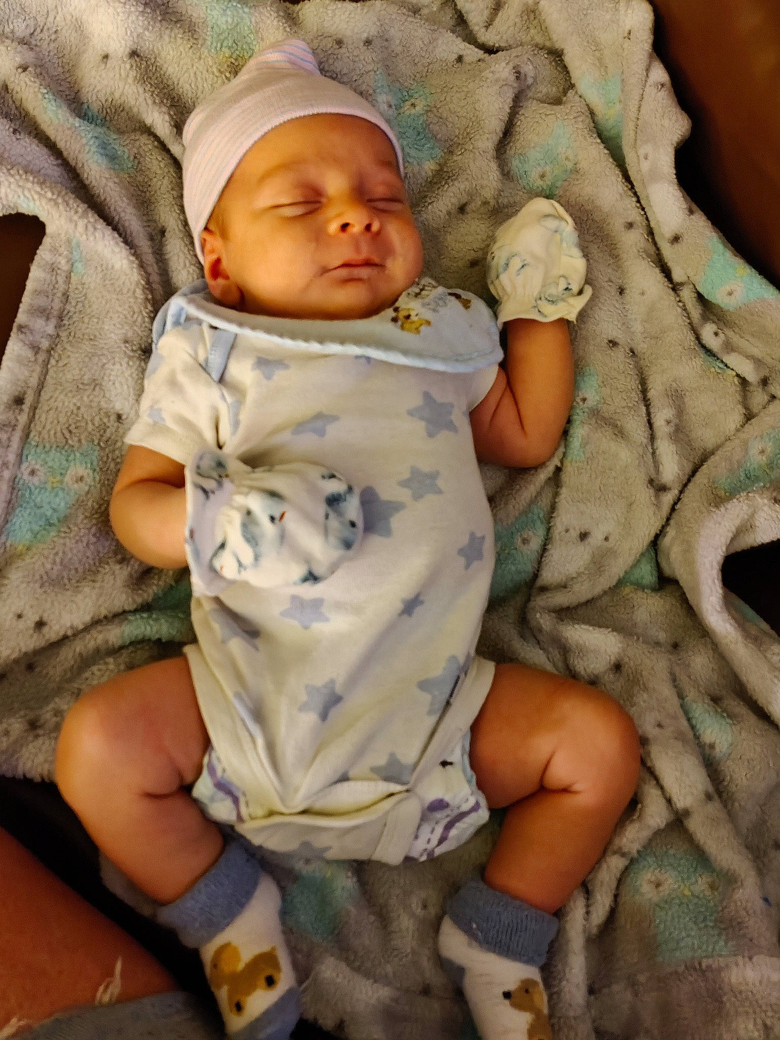 Jonah joined the competition — help win amazing prizes! baby, baby_toddler_clothing, cap, cheek, child, comfort, finger, fun, hat, headgear, headwear, human, human_leg, linens, mouth, organ, pattern, person, sitting, skin