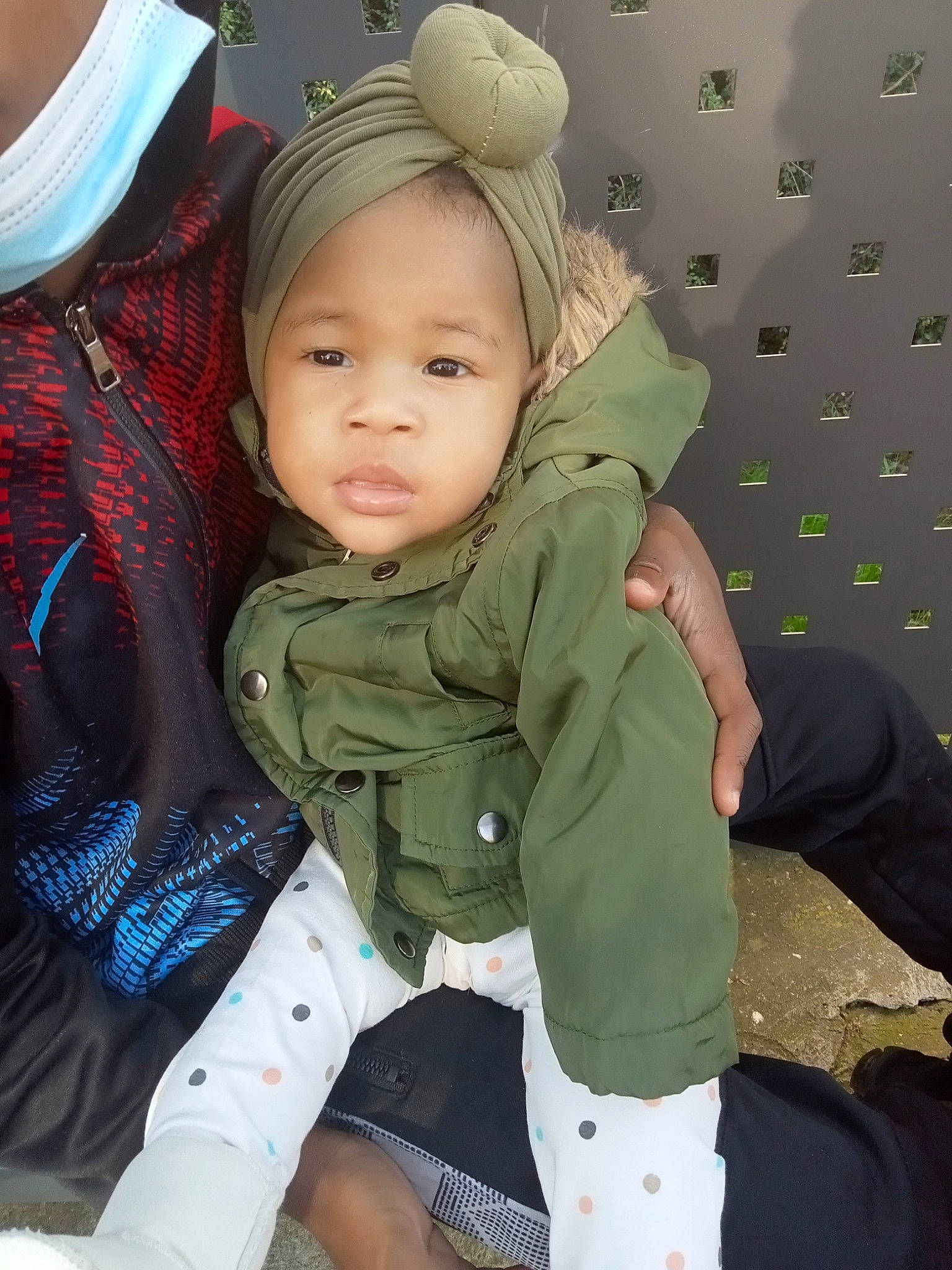 Thaina participe au concours pour gagner de l'argent avec cette photo : baby, baby_toddler_clothing, cap, cheek, child, comfort, cool, eye, finger, fun, gesture, happy, headgear, human_body, military_camouflage, person, sitting, sleeve, thumb, toddler