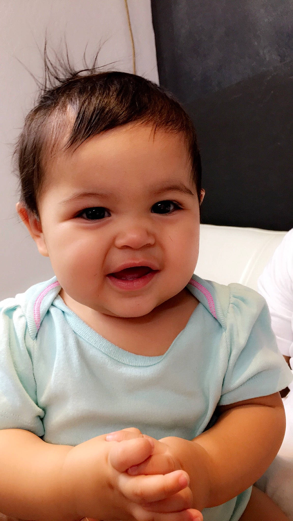 Lili is registered to the contest to win money with this photo: baby, beauty, brown_hair, cheek, child, chin, eye, face, facial_expression, forehead, happy, head, iris, lip, mouth, nose, person, sitting, skin, smile